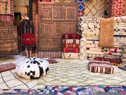 Moroccan rugs unrolled during a guided rug shopping tour in Marrakech